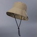 Detail view of water-resistant nylon sun hat with reversible yellow graffiti lining - M(56-58cm) / Double-sided Graffiti Style / Khaki