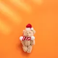 Christmas teddy bear plush keychain with red scarf and hat on orange background - Brown Bear Style C (Red White Striped Scarf)