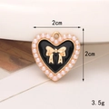 Dettaglio ciondolo a cuore in smalto nero, fiocco dorato e perle con misura 2cm - Stile Fibbia per Scarpe Trasparente / Stile Cuore Perla Smalto (C452)