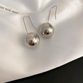 Minimalist silver spherical drop earrings featuring high-polish finish on white satin - Style 19 / Silver