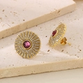 Close-up of vintage titanium steel stud earrings with purple center stone and crystal halo - Gold Purple (KE116356-KFC)