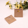 Macro view of 5x5cm PVC earring display cards with Sterling Silver text and floral accent - 5*5cm Brown Earring Cards (100Pcs)
