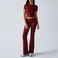 Women's two-piece yoga set with short sleeve crop top and flared pants in wine red color - S / Burgundy
