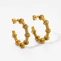 Twisted spring hoop earrings in golden stainless steel with spiral geometric design - Gold Spiral Large Hoop Style (KDE2019)