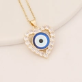 Gold heart necklace with micro-pave crystals and blue evil eye pendant on a beige tray - Blue White Black Devil Eye (3#)