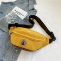Yellow canvas crossbody chest bag with adjustable brown strap and XH logo patch - Yellow