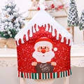 Detail of red Christmas chair cover featuring Santa Claus and Warm Wishes text - Santa Claus