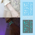 Luminous temporary tattoos with white butterfly and star designs in glowing cyan JSN-023 - JSN-023 (Luminous Butterfly Moon)