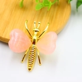 Pink heart-shaped crystal bee ornament with gold metal body on a wooden base - Gold Plated Rose Quartz