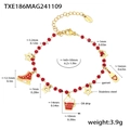 Detail of Christmas gold beaded bracelet with red garnet and festive oil drip charms - Gold Garnet Christmas Element Bracelet (TXE186)
