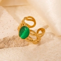 Detail of a vintage braided gold ring with an oval green cat-eye stone on a stone base - Braided Green Cat's Eye Adjustable Style (TYR0717)