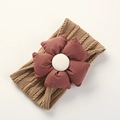Detailed texture of brown jacquard nylon headband with a large wine red floral accent - Coffee