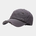 Detailed view of the distressed edges and worn-out holes on the charcoal cotton baseball cap - Dark Gray