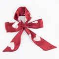 Red silk ribbon hair band with white heart pattern tied in a bow on white background - S65-Red Heart Print