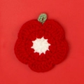 Handmade red crochet flower coaster with white center and small green loop hook - Red Crochet Flower