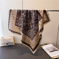 Detail view of silk texture floral scarf with classic paisley patterns and geometric borders - Dark Brown