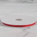 Vibrant red satin ribbon roll on marble background for gift wrapping and DIY crafts - 0.6cm Wide Encrypted Polyester 91m