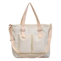 White canvas tote bag with double front pockets and adjustable straps for daily use - White