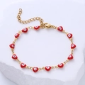 Pulsera dorada de acero inoxidable con dijes de corazón en esmalte rojo y ojo turco de la suerte - Ojo Rojo