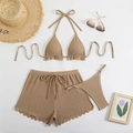 Flat lay of brown 3-piece bikini set with textured fabric and matching beach shorts - S / Coffee