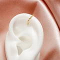 Twisted gold rope ear cuff for non-pierced ears shown on a white ear model - 07 Bamboo Joint (WG0-0434)