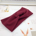 Knitted stretch wide headband with stylish knot design in elegant wine red color - Burgundy