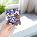 Blue trifold wallet with cute cartoon dog patterns and a brown leather clasp - Handheld Patchwork Puppy Pattern