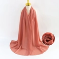 Solid flesh pink pearl chiffon scarf for women shown on a professional mannequin - Khaki