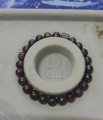 Polished red tiger eye beaded bracelet with 17cm inner diameter and dark metal bead - 6245K Red Tiger Eye