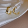 Three-layer interlocking gold hoop earrings with a polished metallic finish on white silk - 35# Silver Needle - Beaded Bouquet White