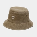 Detail showing vintage washed cotton fabric and heart embroidery on the bucket hat - One Size / Khaki