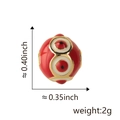 Red Evil Eye charm bead in gold finish with white circle patterns and dimensions - Red