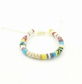 Close-up of colorful Bohemian hand-woven bracelet with adjustable knot on white background - US 6