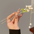 Detail of a lily of the valley hair pin with white pearls, green leaves and gold tassels - F0544 Lily of the Valley