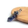Hexagonal resin crystal pendant with blue natural stone chips on a wooden base - Resin Lapis Lazuli