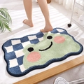 Absorbent bath mat featuring a cute cartoon frog face on blue checkered plush fabric - Froggy