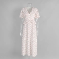 Detail of floral V-neck dress with puff sleeves and waist ruffle on white fabric - S / Red