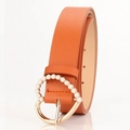 Orange leather belt for women featuring a gold heart buckle with pearl inlay - Camel
