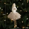 Plush Christmas angel doll with beige hat and brown skirt hanging on a festive tree - Plush Girl Pendant Style G