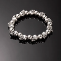 Punk style silver skull bead bracelet for men with metallic finish on black background - 11 Skulls Silver (L274)