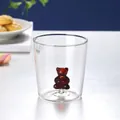 Creative glass water cup with a 3D blue bear figurine at the bottom for home decor - Yellow Bear