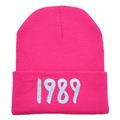 Macro detail of high-quality 1989 white embroidery on a bright pink knitted beanie hat - Adult (Stretchy) / Rose Red
