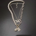 Double-layered necklace with butterfly pendant, baroque pearl and square relief medallion - Pearl Butterfly Silver