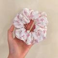 Handheld view of a large white lace scrunchie with pink bow patterns for women - Q617-1 White Pink Bow Large