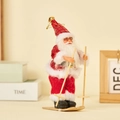 Christmas Santa Claus skiing figurine with red suit, wood skis and golden bell ornament - Skiing Style (Red Patch)