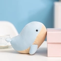 Cute light blue plush whale doll sitting by a pink gift box in a cozy scene - Humpback Whale / 17cm