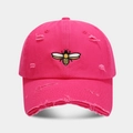 Close-up of rose red baseball cap featuring detailed bee embroidery and distressed rips - Adjustable / Rose Red