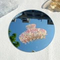 Detail of large acetate hair claw clip with pink and yellow marble texture on mirror - Pink Yellow White Gradient