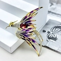 Elegant phoenix brooch with colorful enamel wings and red crystal on a gold-tone base - Purple