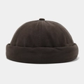 Detalle del gorro docker de algodón marrón oscuro sin ala con textura retro cosida - gris oscuro